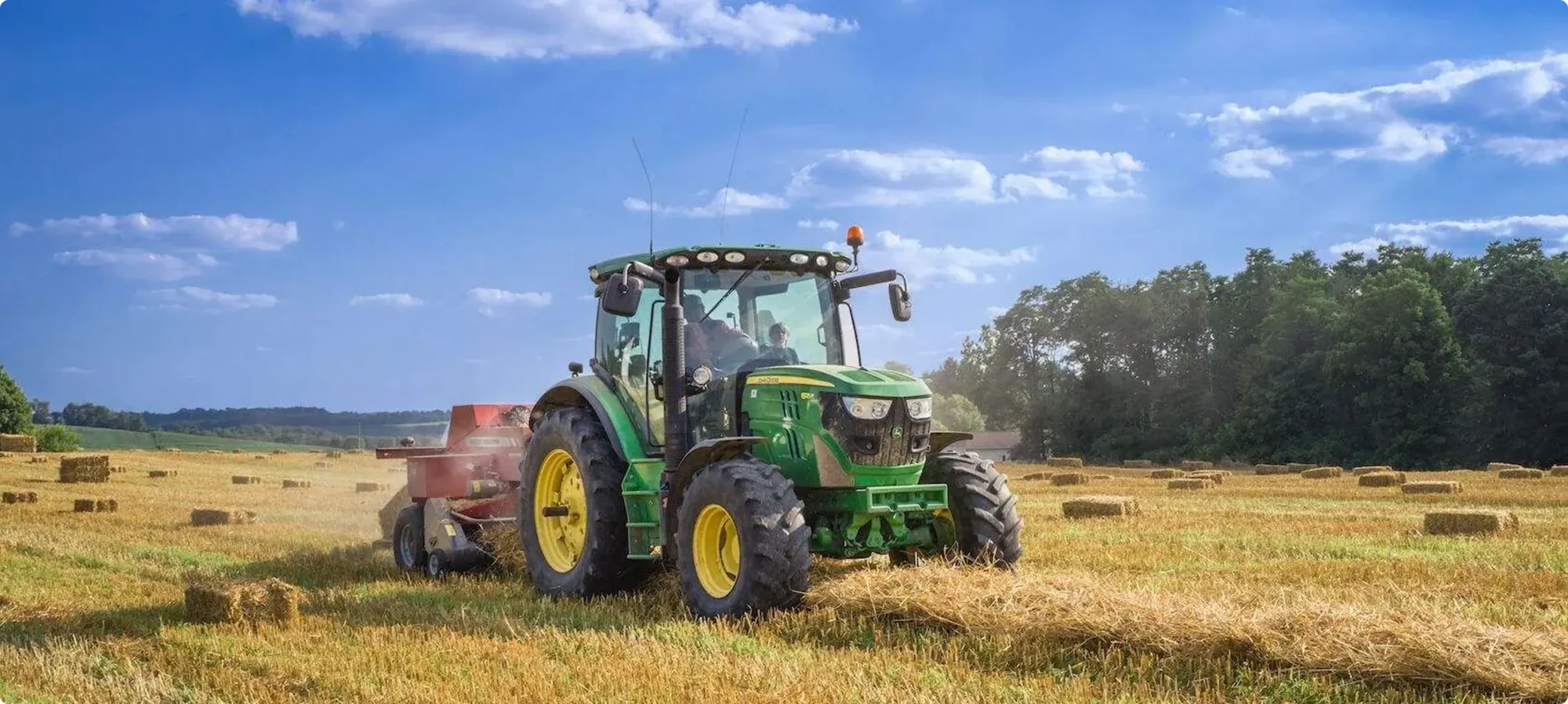 John Deere tractor working in a field