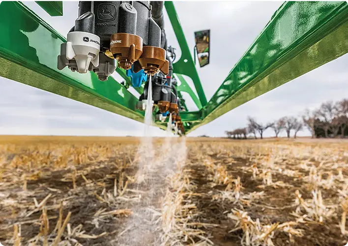 Machine spraying in a field